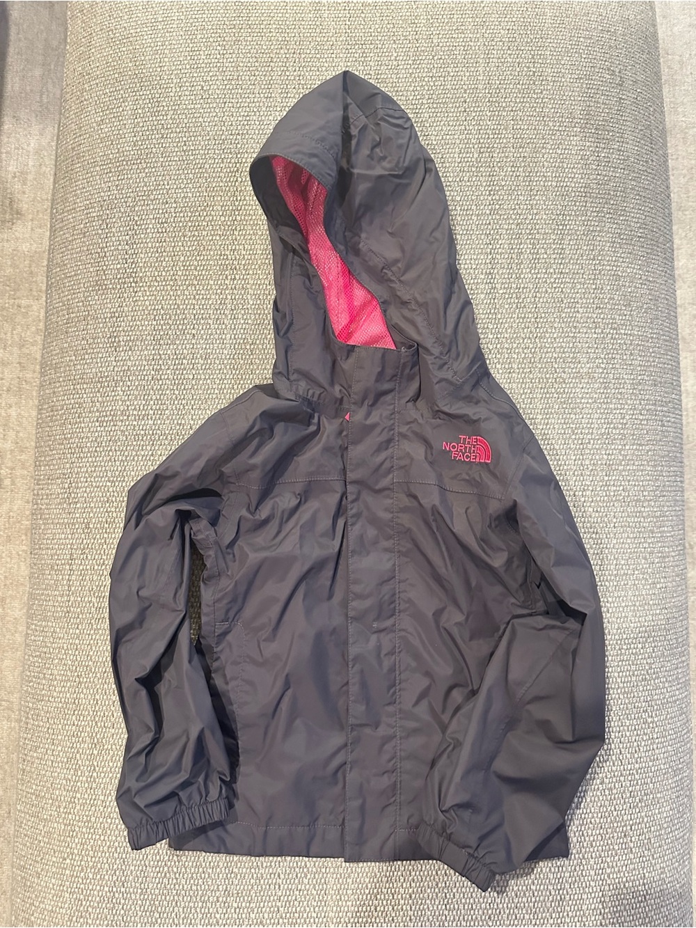 The North Face Kids Hooded Raincoat in Charcoal with Pink Lining